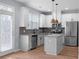 Modern kitchen with stainless steel appliances, granite countertops, and an island at 3266 Spicy Cedar Ln, Lithonia, GA 30038