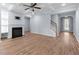 Bright living room featuring hardwood floors, coffered ceilings, and a fireplace at 3266 Spicy Cedar Ln, Lithonia, GA 30038