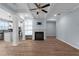 Open-concept living room with hardwood floors, fireplace, and a view of the kitchen at 3266 Spicy Cedar Ln, Lithonia, GA 30038