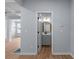 Elegant powder room with gray vanity, modern fixtures, and wood-look flooring at 3266 Spicy Cedar Ln, Lithonia, GA 30038