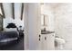 Stylish ensuite bathroom with marble walls, white cabinets, and view of bedroom at 455 Peachtree Battle Nw Ave, Atlanta, GA 30305