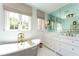 Bright bathroom featuring a stylish bathtub with gold fixtures, marble countertops, and a large mirrored wall at 455 Peachtree Battle Nw Ave, Atlanta, GA 30305