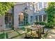 Charming outdoor courtyard with stone pavers and a wooden table at 455 Peachtree Battle Nw Ave, Atlanta, GA 30305