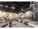 Spacious home gym with mirrored walls, exposed ceiling, and state-of-the-art equipment at 455 Peachtree Battle Nw Ave, Atlanta, GA 30305