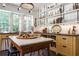 Beautiful kitchen with natural cabinets, an island with a marble top, and open shelving at 455 Peachtree Battle Nw Ave, Atlanta, GA 30305