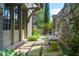 Beautiful walkway with stone pavers, lush greenery, and a decorative bench at 455 Peachtree Battle Nw Ave, Atlanta, GA 30305