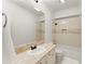 Well-lit bathroom featuring a vanity with granite countertop and a shower-tub combination at 5043 Willeo Estates Dr, Marietta, GA 30068