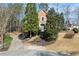 Charming two-story brick home featuring a manicured front yard and mature trees at 5043 Willeo Estates Dr, Marietta, GA 30068