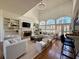 Airy living room with vaulted ceilings, a fireplace, and large windows, offering a perfect gathering space at 5043 Willeo Estates Dr, Marietta, GA 30068