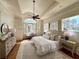 Serene main bedroom featuring a barrel ceiling, large windows, and stylish decor for ultimate relaxation at 5043 Willeo Estates Dr, Marietta, GA 30068