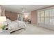 Spacious main bedroom with a large window featuring plantation shutters and neutral colored walls at 5043 Willeo Estates Dr, Marietta, GA 30068