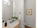 Stylish powder room featuring decorative mirror and unique vanity at 5043 Willeo Estates Dr, Marietta, GA 30068