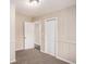 Inviting bedroom showcases paneled walls, neutral tones, and plush carpeting, creating a tranquil space at 3173 Canary Ct, Decatur, GA 30032