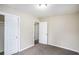 Bright bedroom featuring neutral walls, plush carpeting, and recessed lighting for a cozy ambiance at 3173 Canary Ct, Decatur, GA 30032