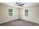Cozy bedroom with neutral carpet and natural light from two windows at 3173 Canary Ct, Decatur, GA 30032