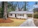 Charming bungalow with a well-manicured front yard and covered parking at 3173 Canary Ct, Decatur, GA 30032