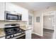 Kitchen includes updated appliances, granite countertops, and ample cabinet space at 3173 Canary Ct, Decatur, GA 30032