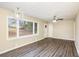 Bright living room features hardwood floors, modern lighting, and large windows at 3173 Canary Ct, Decatur, GA 30032