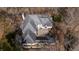 An aerial view of a home, highlighting its unique roofline, chimney and layout at 1458 Sweet Bottom Cir, Marietta, GA 30064