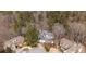 A high angle showing the home nestled amongst a quiet neighborhood with mature trees at 1458 Sweet Bottom Cir, Marietta, GA 30064