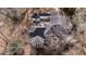Overhead view showcasing the home's layout, roof, and surrounding tree coverage at 1458 Sweet Bottom Cir, Marietta, GA 30064