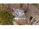 Aerial shot of a large home with a grey roof, set among trees and landscaping at 1458 Sweet Bottom Cir, Marietta, GA 30064