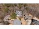 Expansive aerial view of a grand home nestled among mature trees on a cul-de-sac at 1458 Sweet Bottom Cir, Marietta, GA 30064