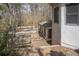 Backyard deck with railing is surrounded by lush greenery and natural beauty at 1458 Sweet Bottom Cir, Marietta, GA 30064