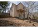 A backyard with tiered hardscaping that descends to a wooded area at 1458 Sweet Bottom Cir, Marietta, GA 30064