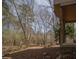 A view of the backyard with a small stream in the wooded area at 1458 Sweet Bottom Cir, Marietta, GA 30064