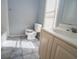 Bathroom with toilet, sink, vanity and natural light at 1458 Sweet Bottom Cir, Marietta, GA 30064