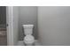 Toilet in a bathroom with gray walls and white tile floor at 1458 Sweet Bottom Cir, Marietta, GA 30064