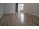 Bedroom with newly refinished hardwood floors, textured wallpaper, and natural light at 1458 Sweet Bottom Cir, Marietta, GA 30064