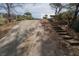 Long driveway leading up to the house, with stairs on the side up to the house at 1458 Sweet Bottom Cir, Marietta, GA 30064