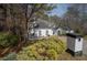 Stunning white stucco home with a well-manicured lawn and beautiful shrubbery at 1458 Sweet Bottom Cir, Marietta, GA 30064