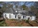 Charming two story home with a unique gated entrance and distinct architectural details at 1458 Sweet Bottom Cir, Marietta, GA 30064