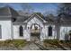 Charming white home with wrought iron gate and manicured lawn, offering a welcoming entrance at 1458 Sweet Bottom Cir, Marietta, GA 30064