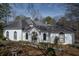 Front exterior of a house with a landscaped yard and manicured bushes at 1458 Sweet Bottom Cir, Marietta, GA 30064