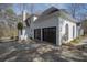 Exterior view of the house featuring a two-car garage with dark brown doors at 1458 Sweet Bottom Cir, Marietta, GA 30064