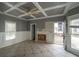 Living room featuring large windows and a unique coffered ceiling, with an exposed area where a fireplace was removed at 1458 Sweet Bottom Cir, Marietta, GA 30064