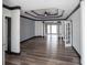 Spacious living room with hardwood floors, dark trim, and elegant tray ceiling, flooded with natural light at 1458 Sweet Bottom Cir, Marietta, GA 30064