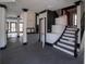 Open-concept living room featuring striking black and white trim, dark floors, and a spiral staircase at 1458 Sweet Bottom Cir, Marietta, GA 30064