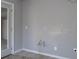 A corner of an unfinished room shows exposed pipes, a door, and neutral walls at 1458 Sweet Bottom Cir, Marietta, GA 30064