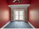 Red room with natural light filtering through the window and shelving at 1458 Sweet Bottom Cir, Marietta, GA 30064