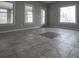 Spacious room with tiled floors and large windows bringing in natural light at 1458 Sweet Bottom Cir, Marietta, GA 30064