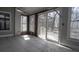 Sunroom featuring tiled floors and several windows looking out to a partially wooded lot at 1458 Sweet Bottom Cir, Marietta, GA 30064