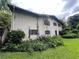 Exterior rear view of home and shed surrounded by lush greenery offering a private backyard space at 2323 Valleyside Dr, Decatur, GA 30032