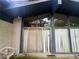 Backyard featuring large windows and sliding glass doors, accented by a white brick exterior at 2323 Valleyside Dr, Decatur, GA 30032