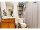 Functional bathroom with a single sink vanity, toilet, and shower-tub combo at 378 Cole Sw Dr, Lilburn, GA 30047