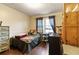Bedroom featuring a bed, dresser, and natural light from the window at 378 Cole Sw Dr, Lilburn, GA 30047